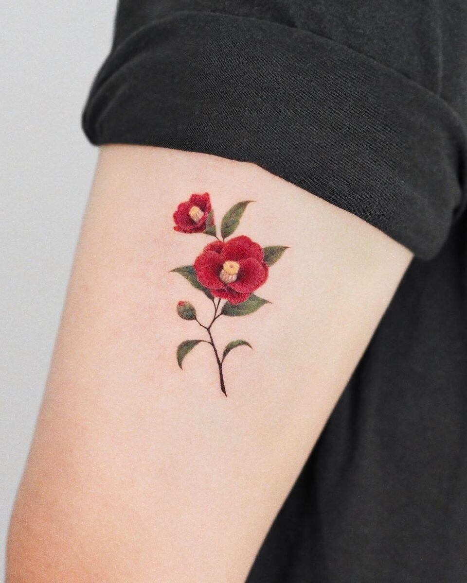 Elegant red camellia tattoo on arm Tattoo Design