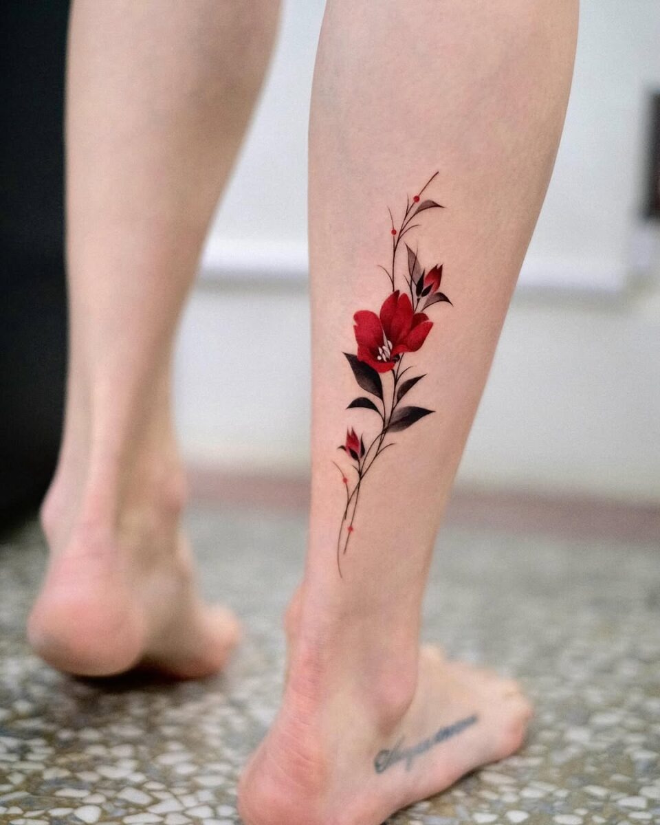 Elegant red camellia tattoo on the leg Tattoo Design