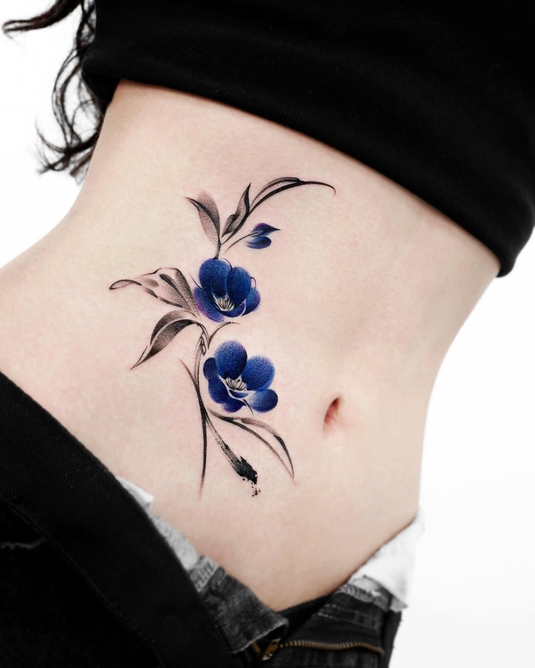 Stunning Blue Camellia Tattoo on Skin Tattoo Design