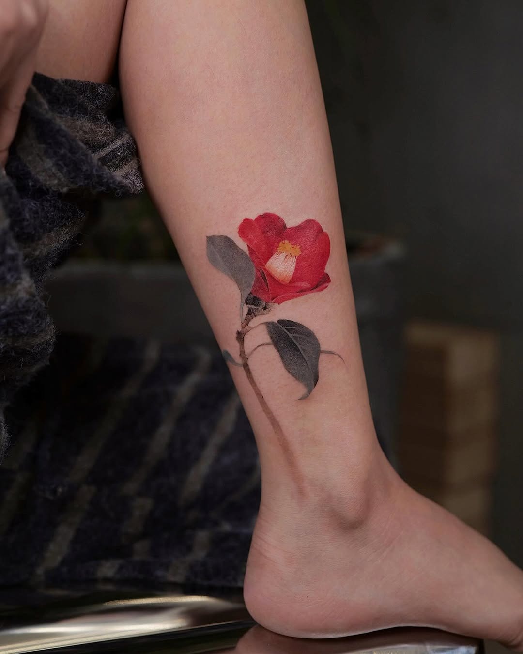 Stunning camellia tattoo on a leg. Tattoo Design