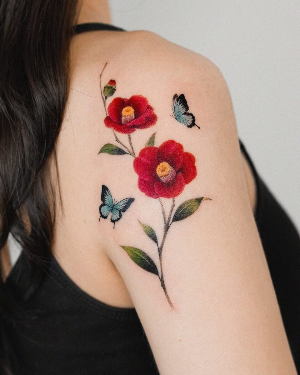 Stunning Camellia Tattoo with Butterfly Accents Tattoo Design