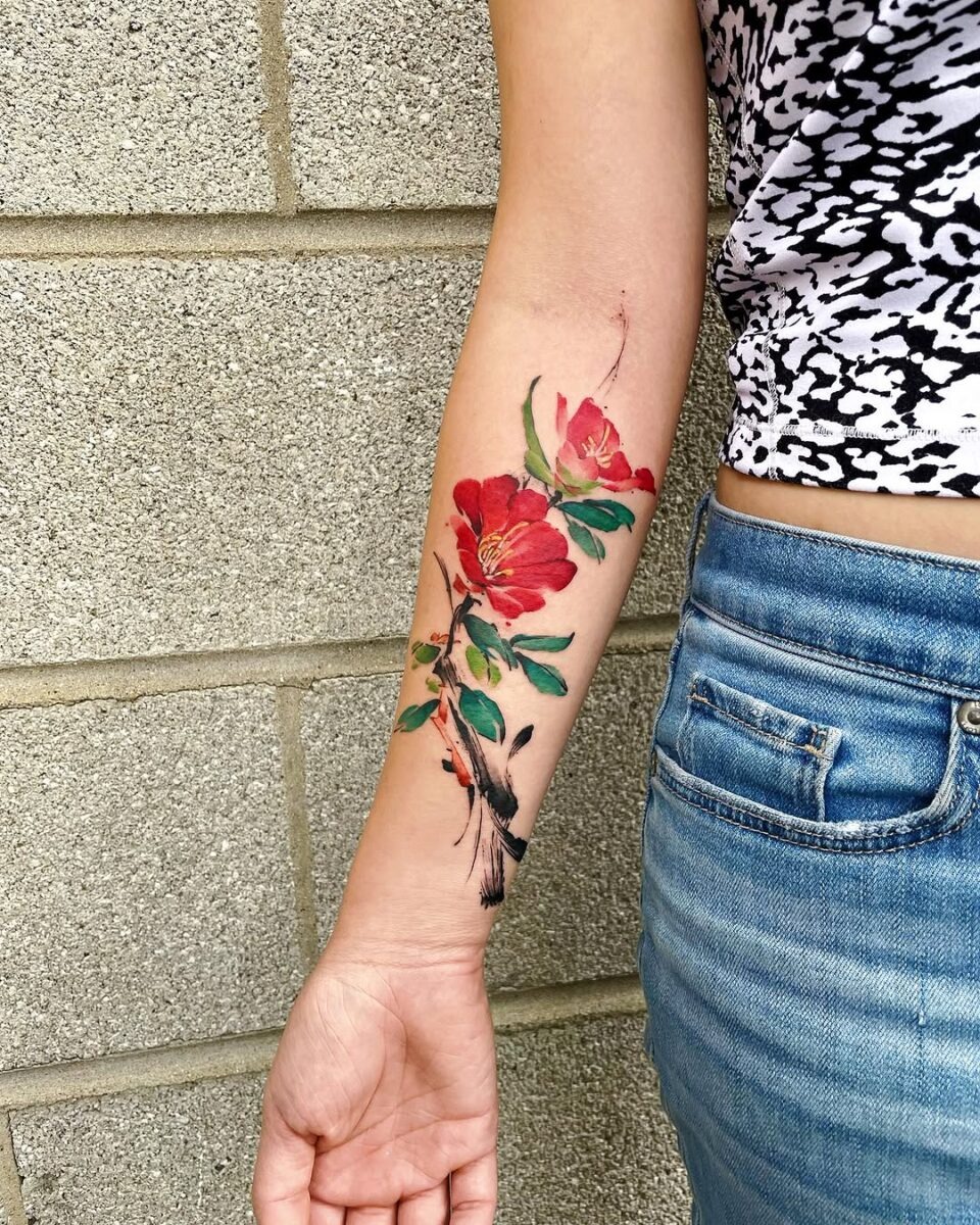Vibrant camellia tattoo design on forearm Tattoo Design