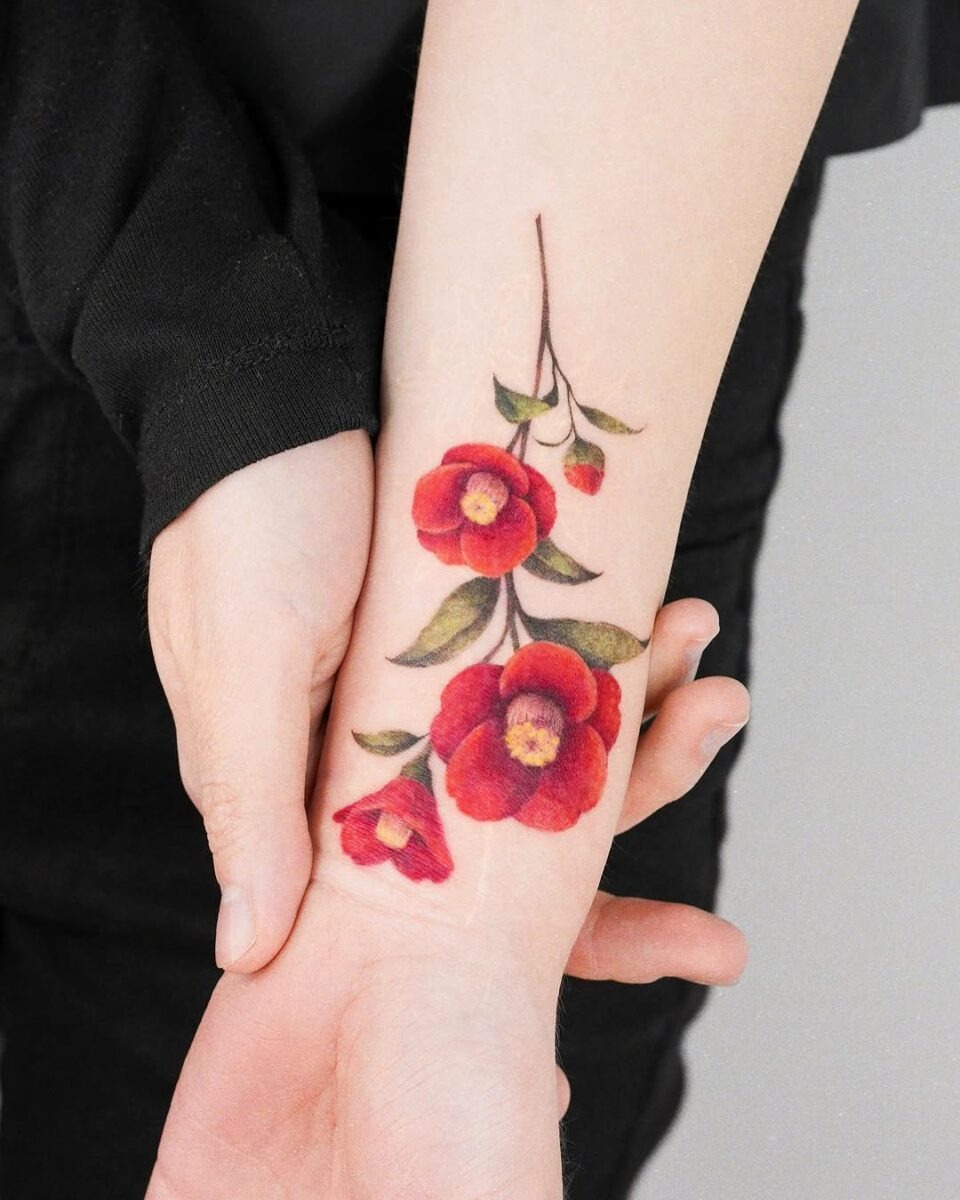 Vibrant camellia tattoo with rich red tones Tattoo Design