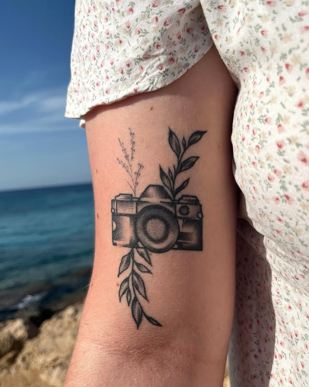 Aesthetic Camera Tattoo with Floral Elements Tattoo Design
