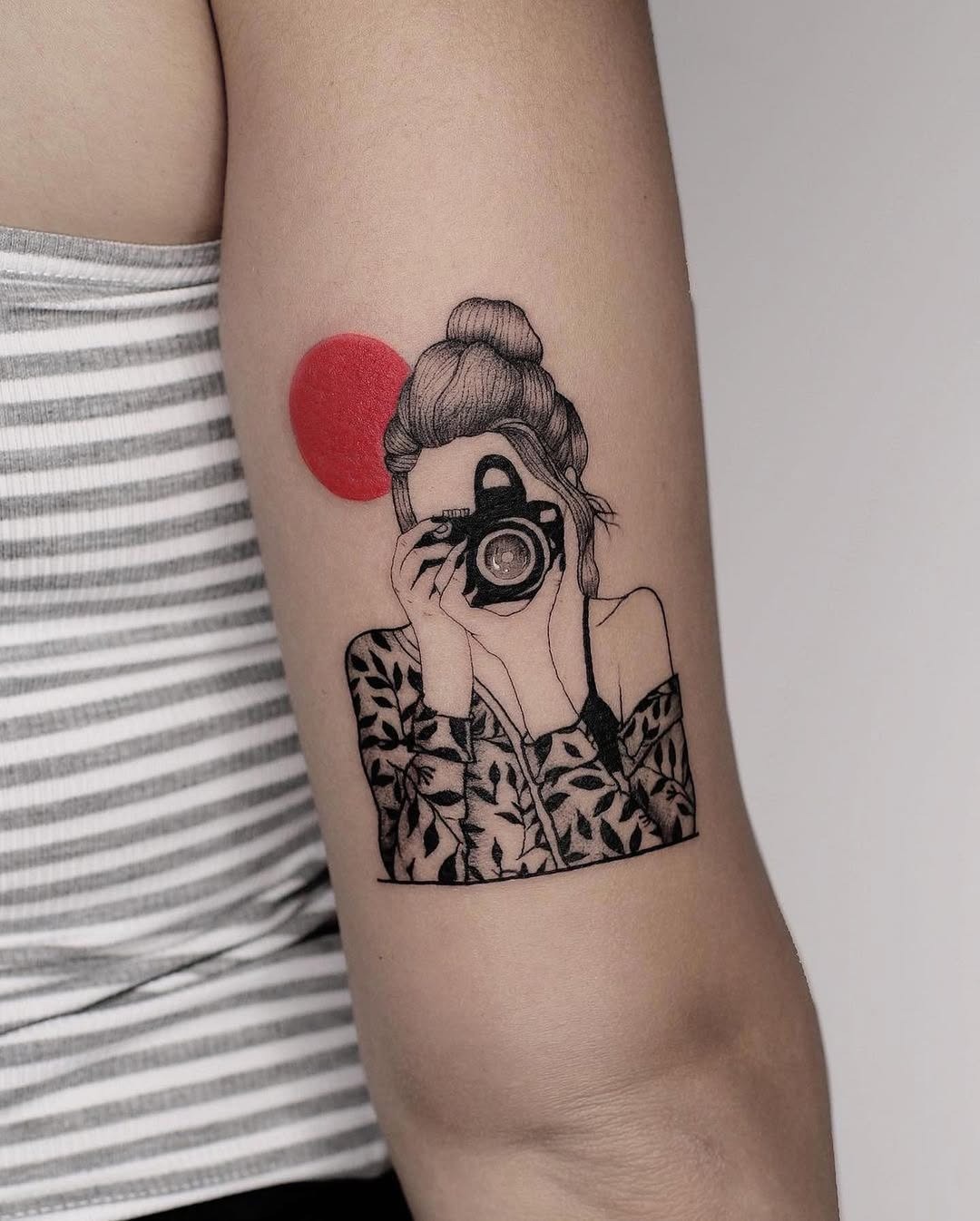 Artistic Camera Tattoo with a Bold Red Circle Tattoo Design