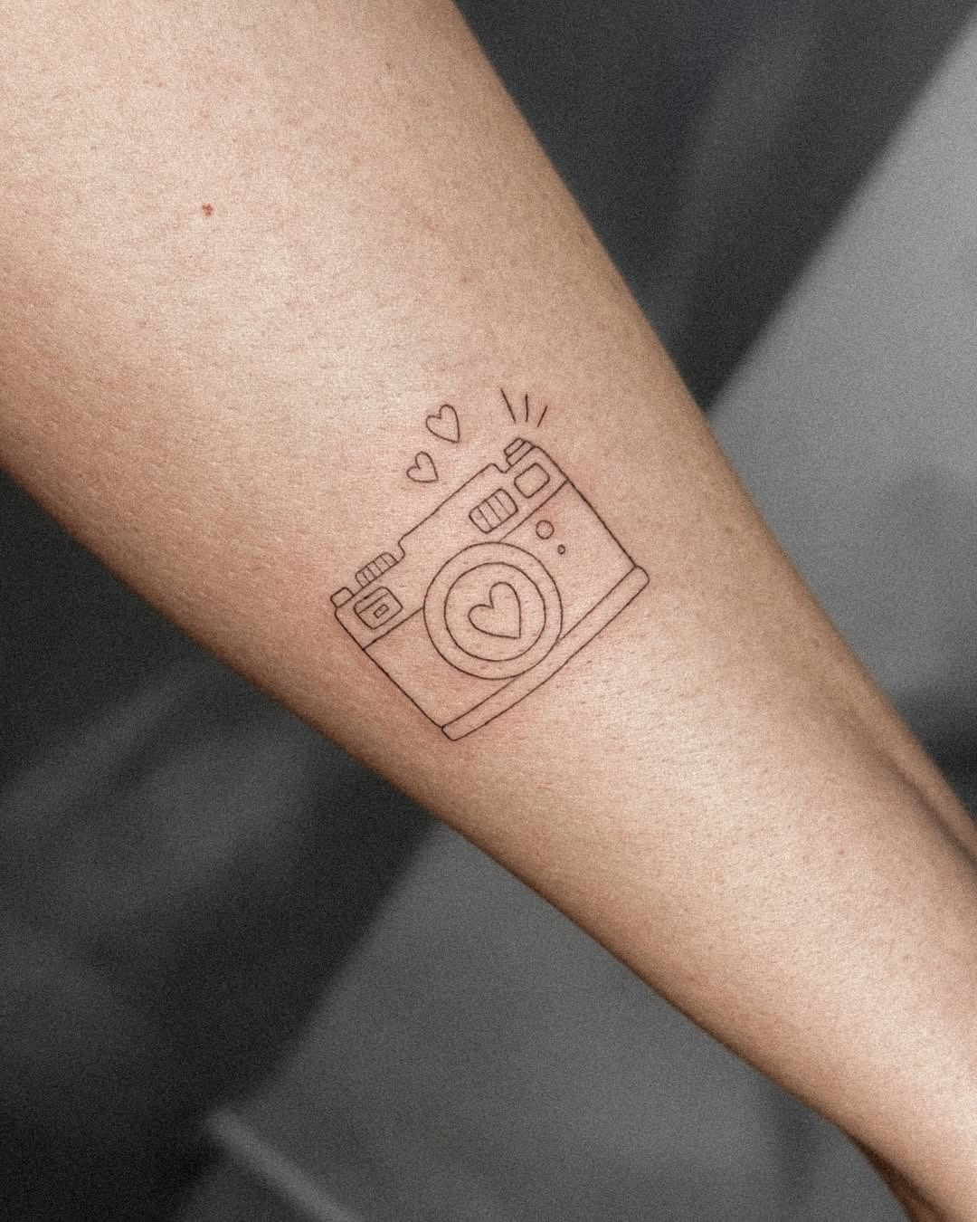 Charming camera tattoo with heart details Tattoo Design