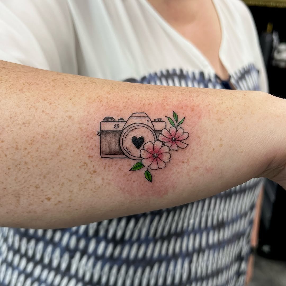 Charming floral camera tattoo design on arm Tattoo Design