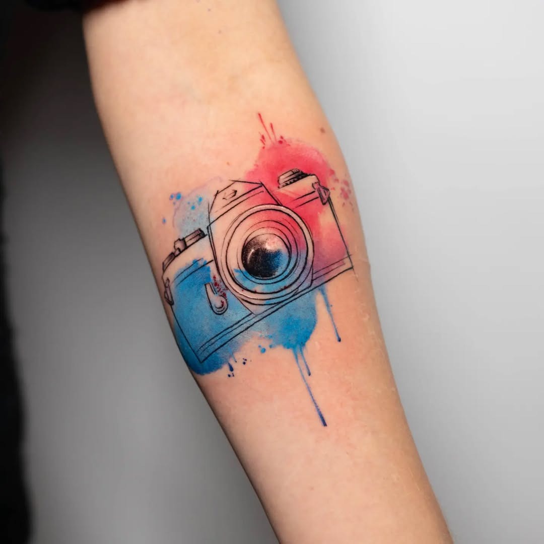 Colorful Camera Tattoo with Artistic Splashes Tattoo Design