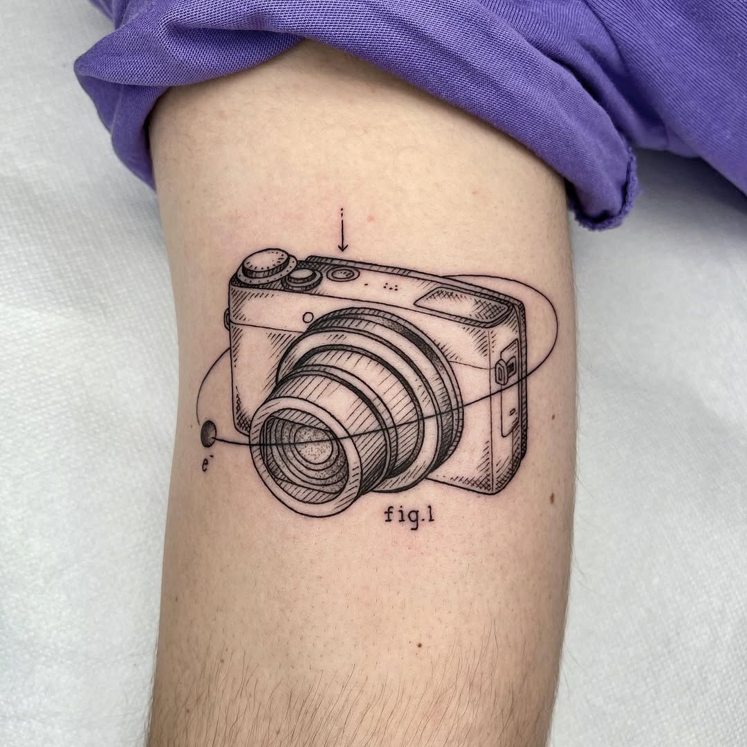 Intricate camera tattoo with artistic details Tattoo Design