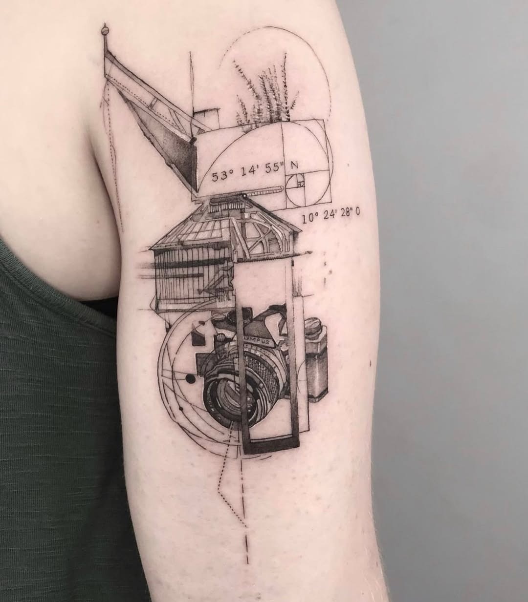 Intricate geometric camera tattoo on the arm Tattoo Design