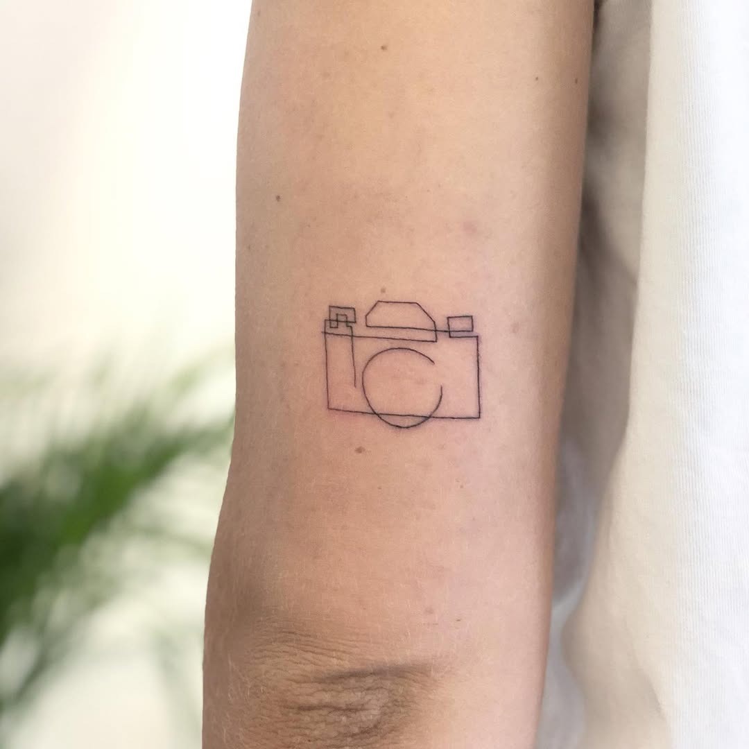 Minimalist camera tattoo for photography lovers Tattoo Design