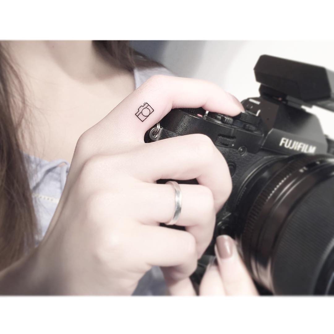 Minimalist Camera Tattoo on Hand Tattoo Design