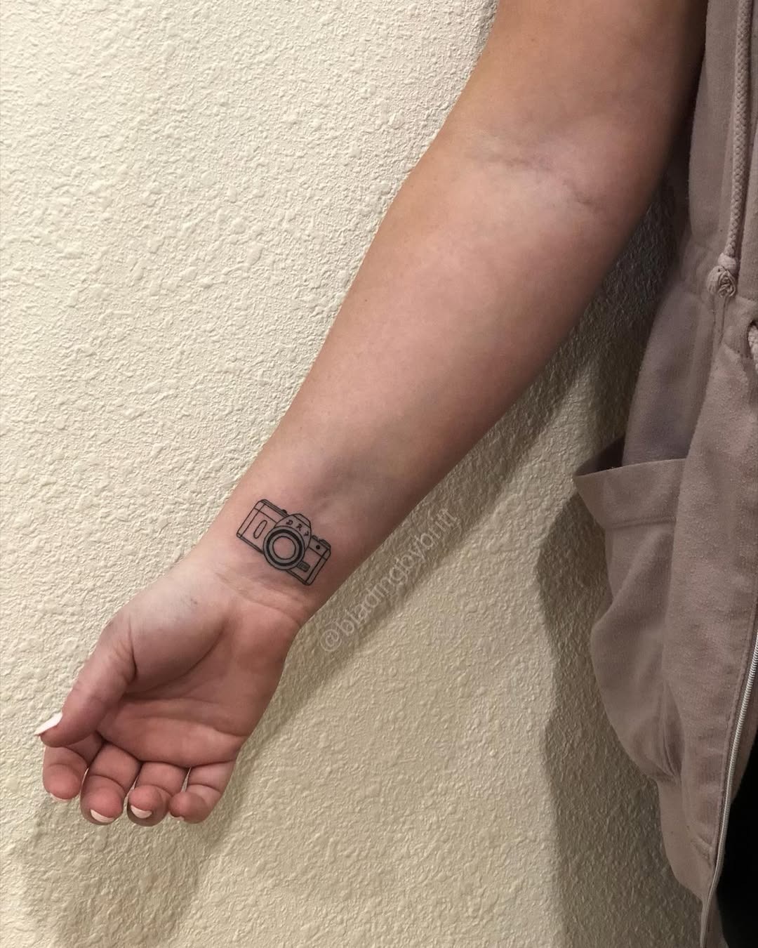 Minimalist Camera Tattoo on the Forearm Tattoo Design