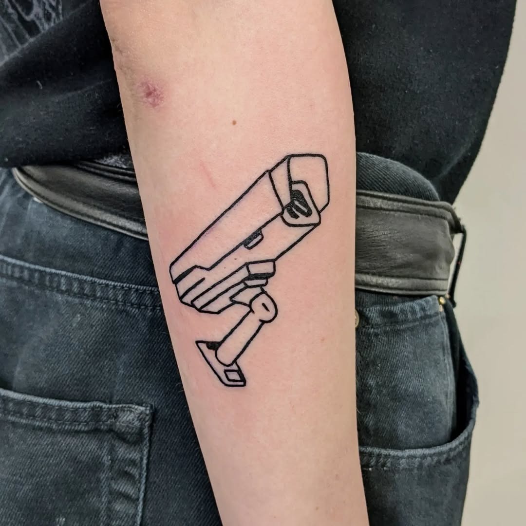 Minimalistic camera tattoo on forearm Tattoo Design