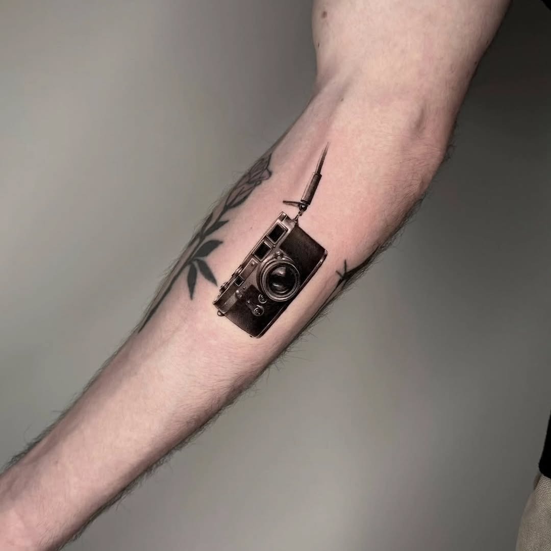 Realistic vintage camera tattoo on forearm Tattoo Design