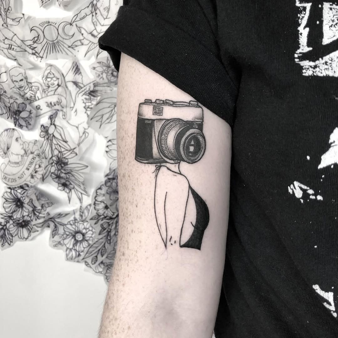 Stylish camera tattoo blending art and identity Tattoo Design