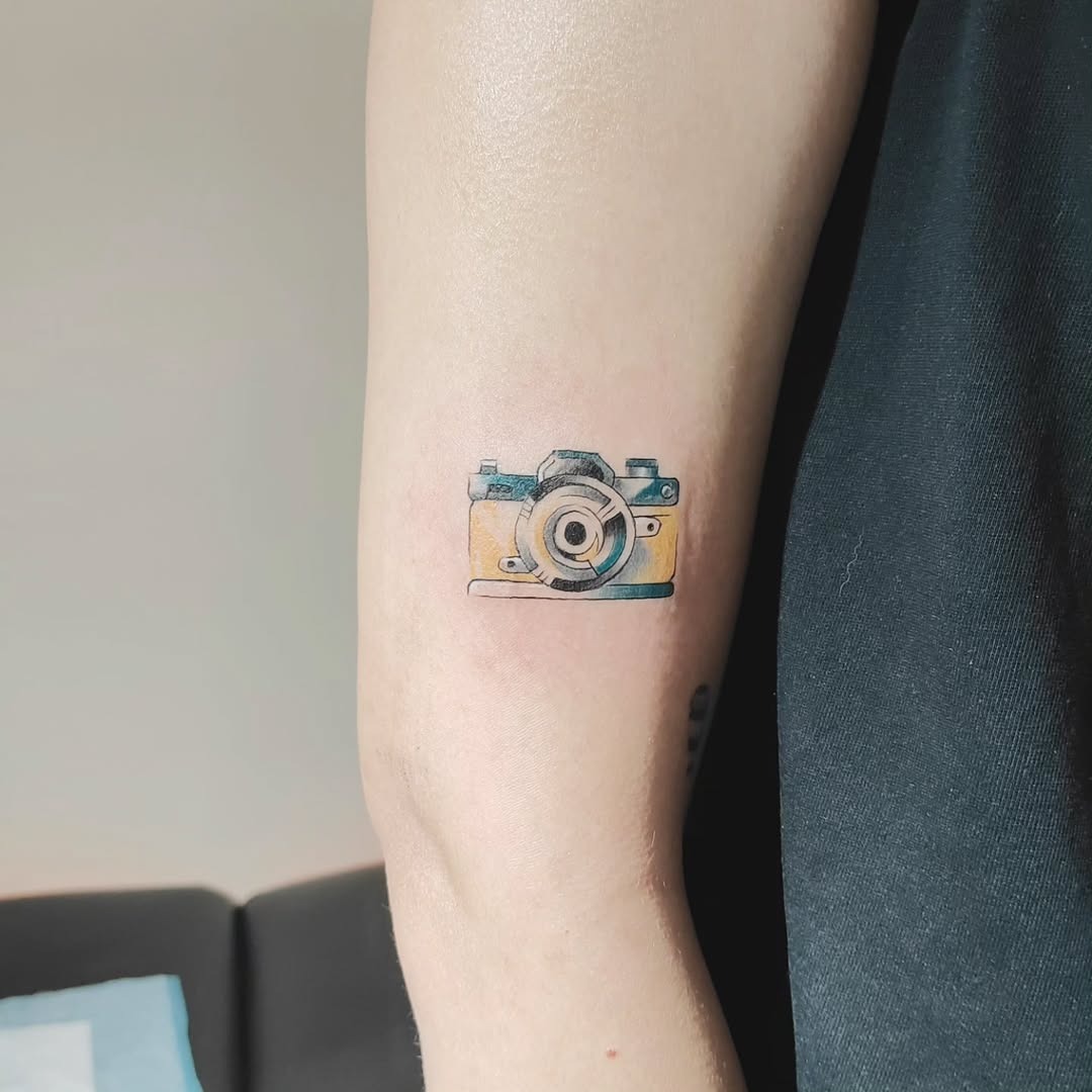 Stylish camera tattoo with vibrant colors Tattoo Design
