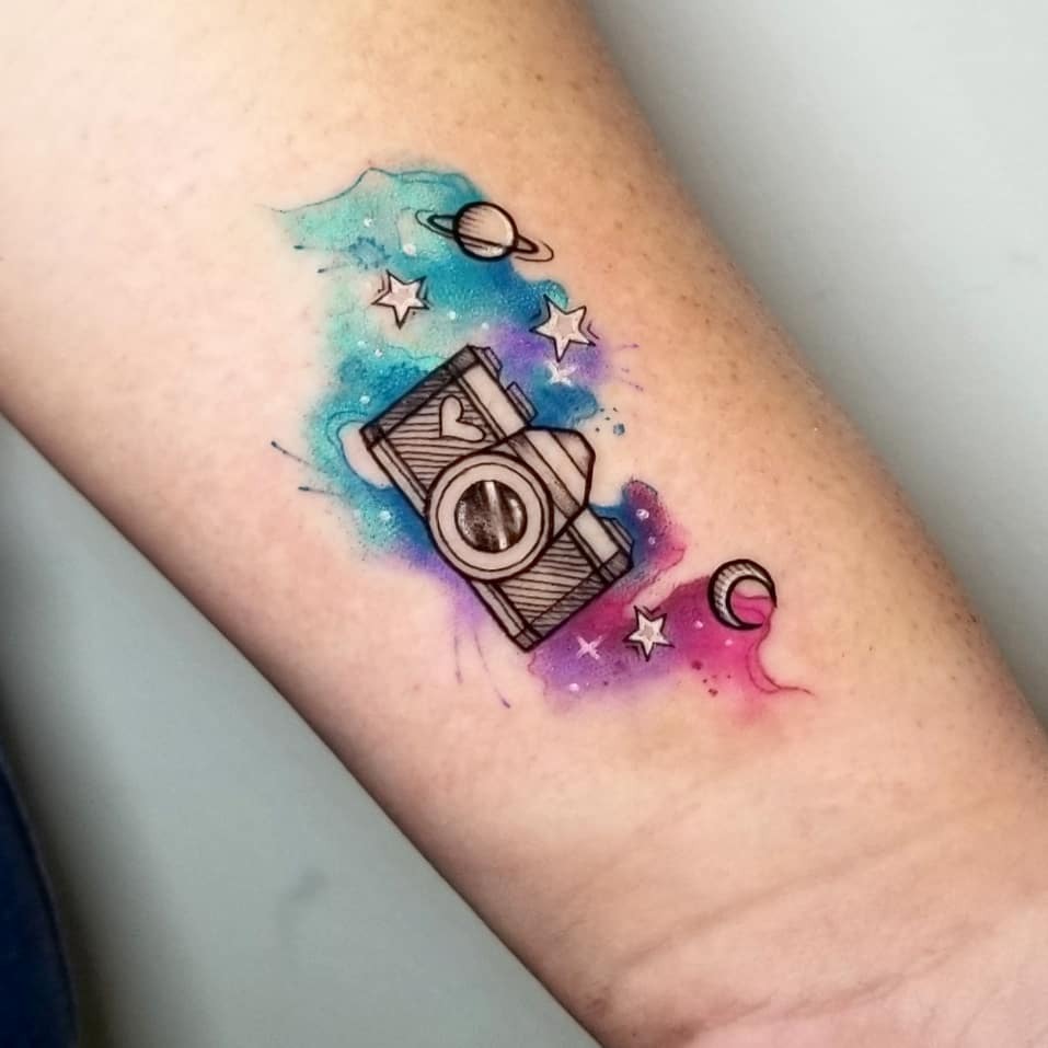 Vibrant camera tattoo with cosmic elements Tattoo Design