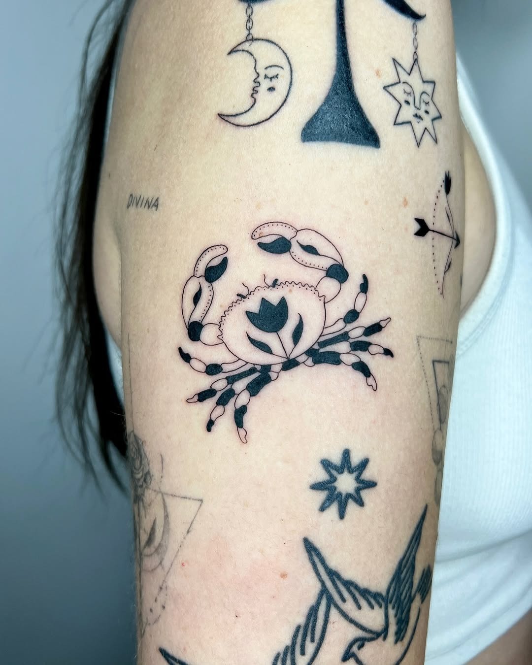 Delicate Crab Tattoo with Floral Elements Tattoo Design
