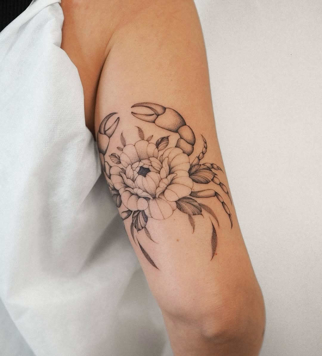 Elegant cancer zodiac tattoo design showcasing floral beauty Tattoo Design