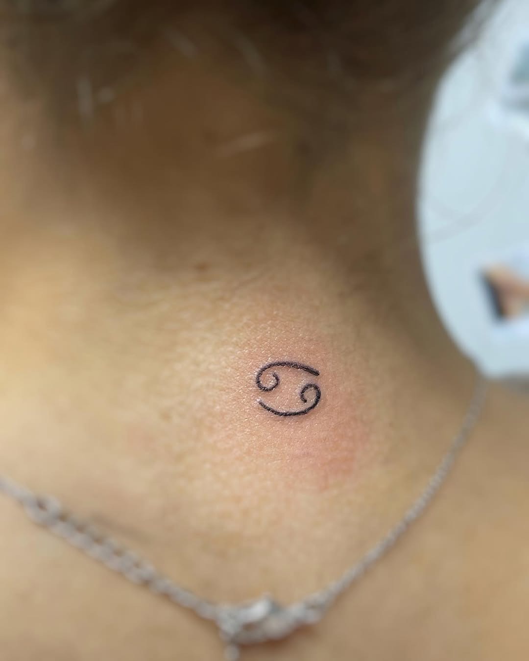 Stylish Cancer Zodiac Tattoo on the Neck Tattoo Design