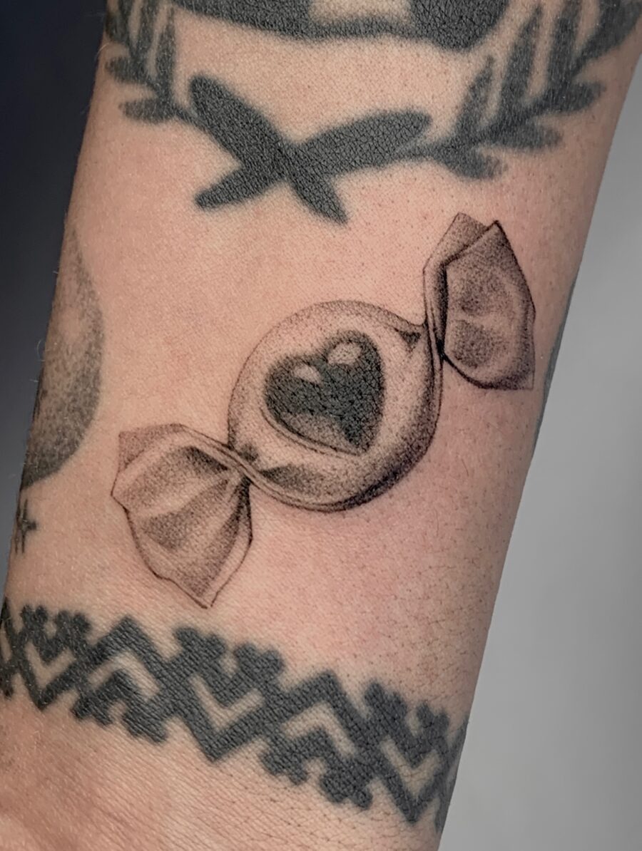 Charming candy heart tattoo with delicate details Tattoo Design