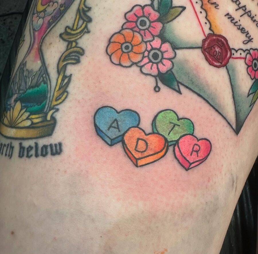 Colorful candy heart tattoos with letters Tattoo Design