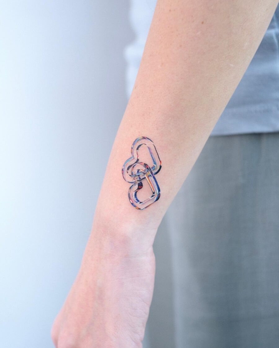 Playful candy heart tattoo design on arm Tattoo Design