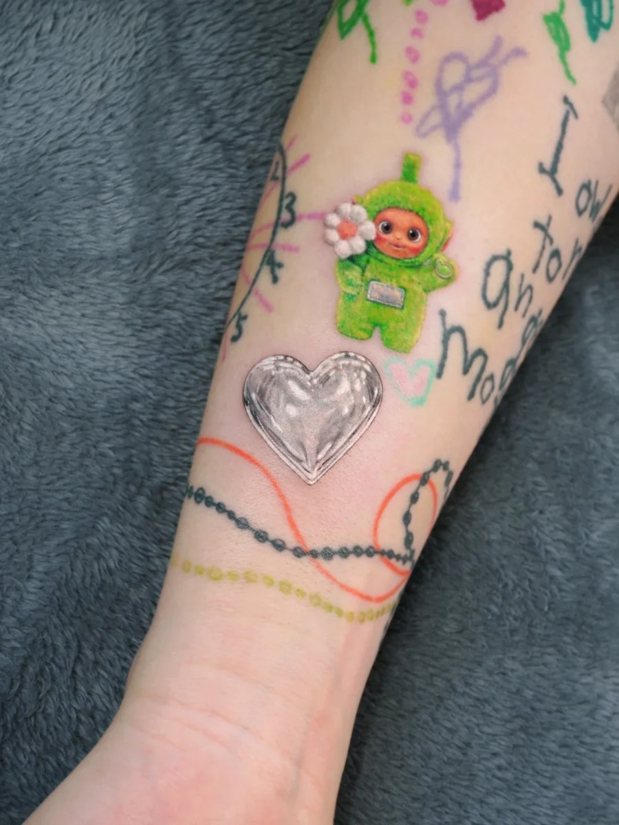 Playful candy heart tattoo with a charming twist Tattoo Design