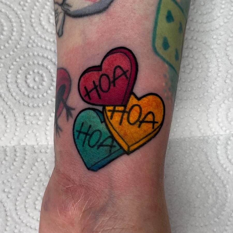 Playful candy heart tattoo with a sweet message Tattoo Design