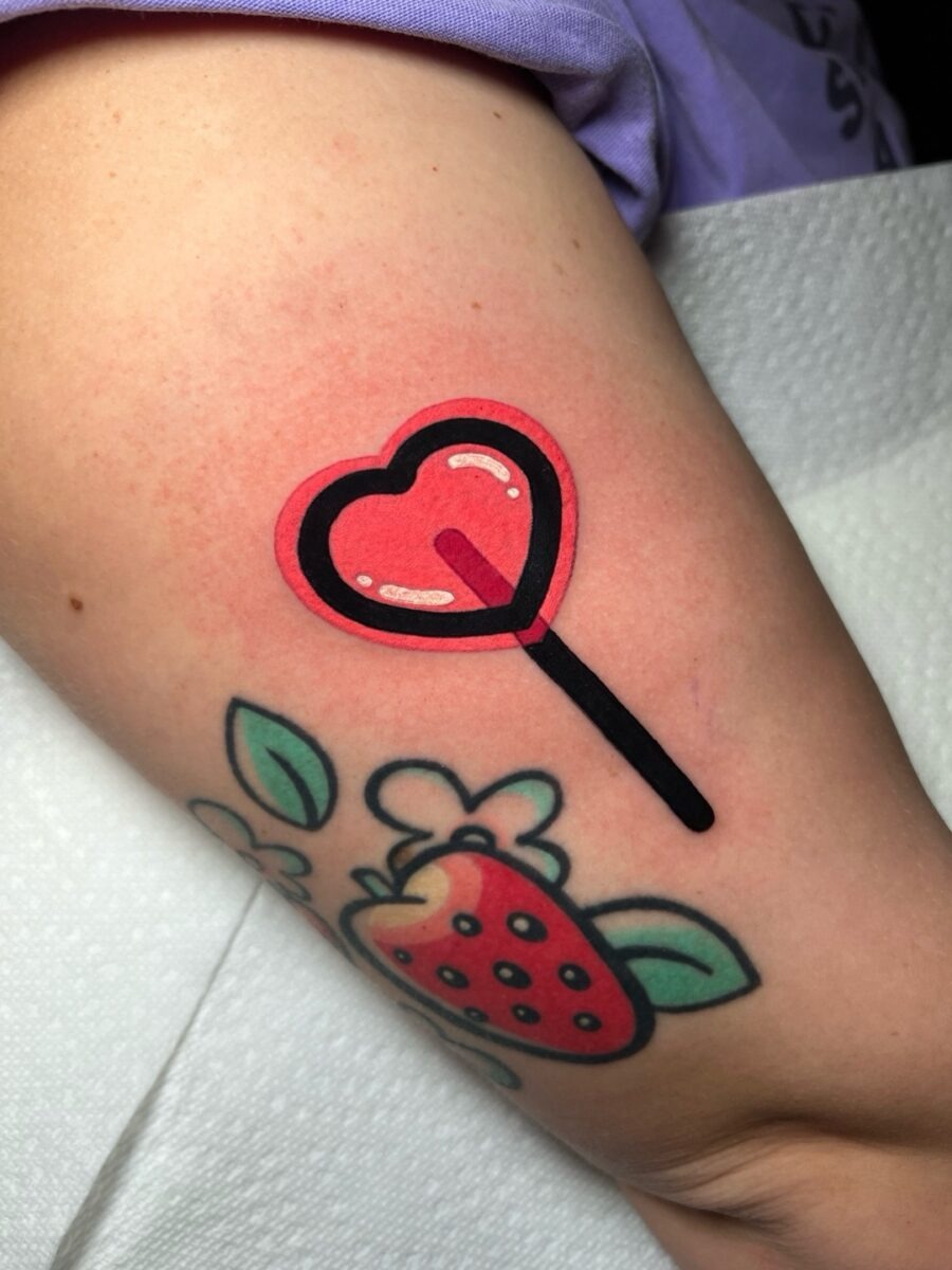 Playful heart-shaped lollipop tattoo design Tattoo Design