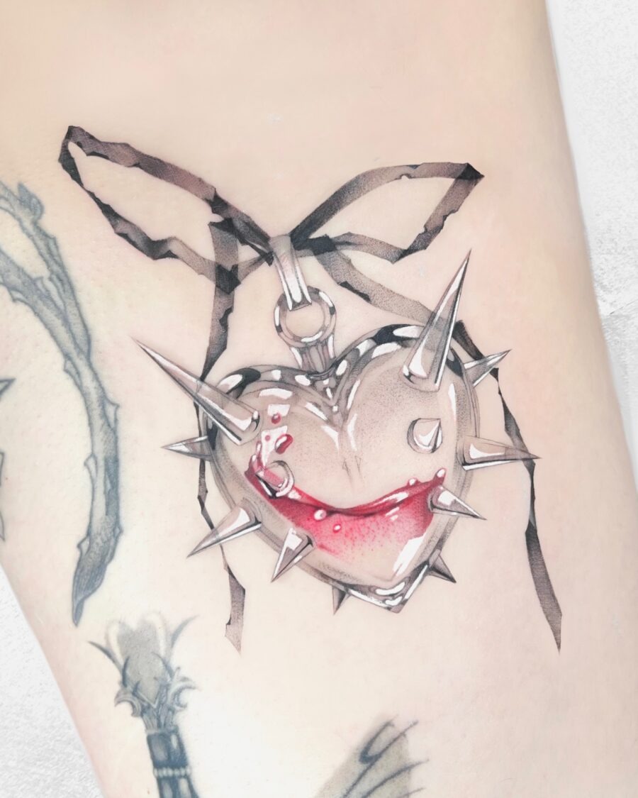 Unique spiked candy heart tattoo with red accents Tattoo Design