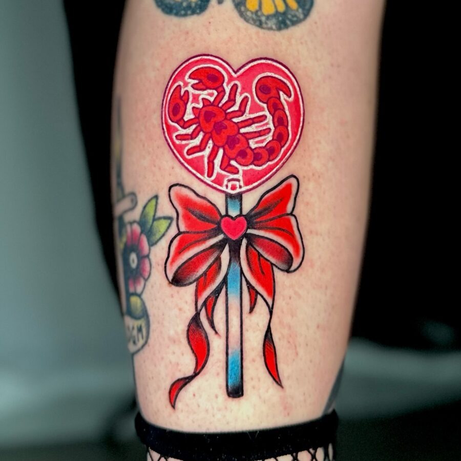 Vibrant candy heart tattoo with scorpion design Tattoo Design