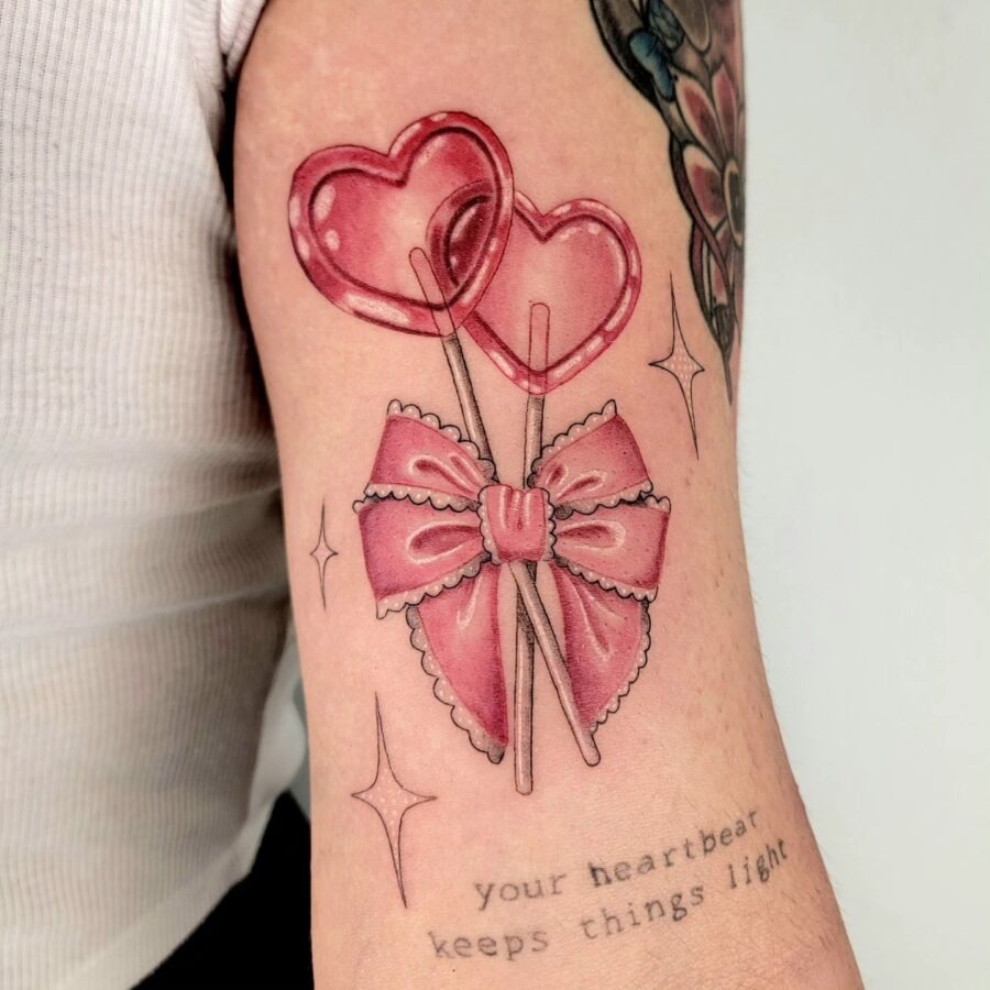 Whimsical candy heart tattoo with a bow Tattoo Design