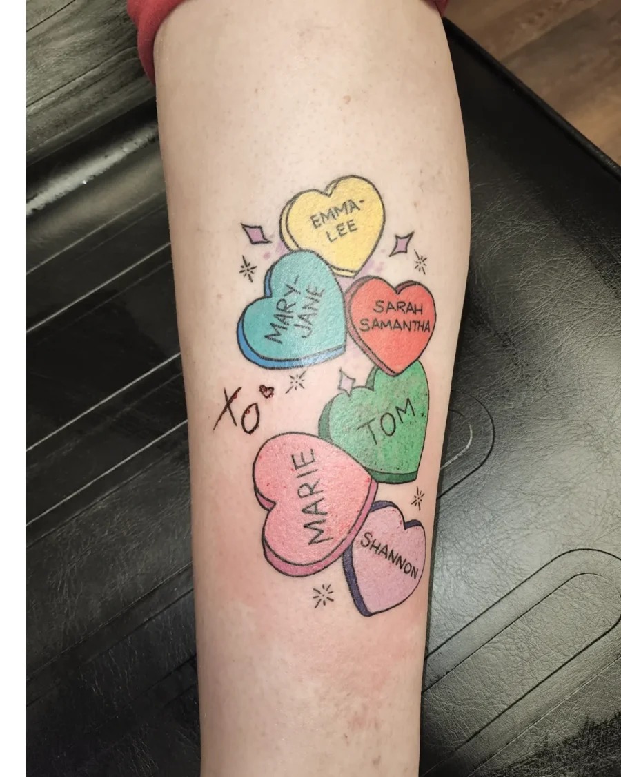 Whimsical candy heart tattoos with playful names Tattoo Design
