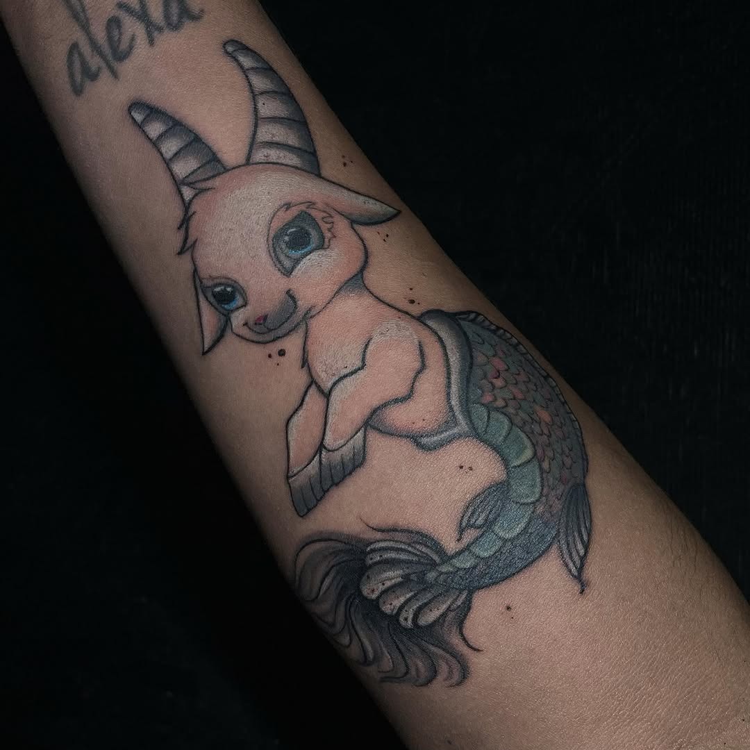 This Capricorn tattoo beautifully combines a goat and a mermaid, showing creativity.
