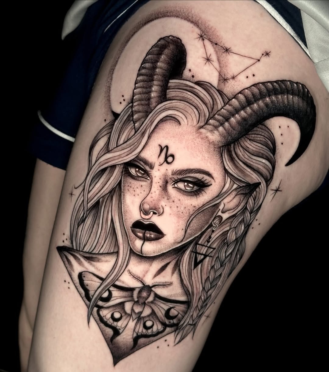 This stunning Capricorn tattoo showcases an intricate design featuring a beautiful woman with prominent horns.