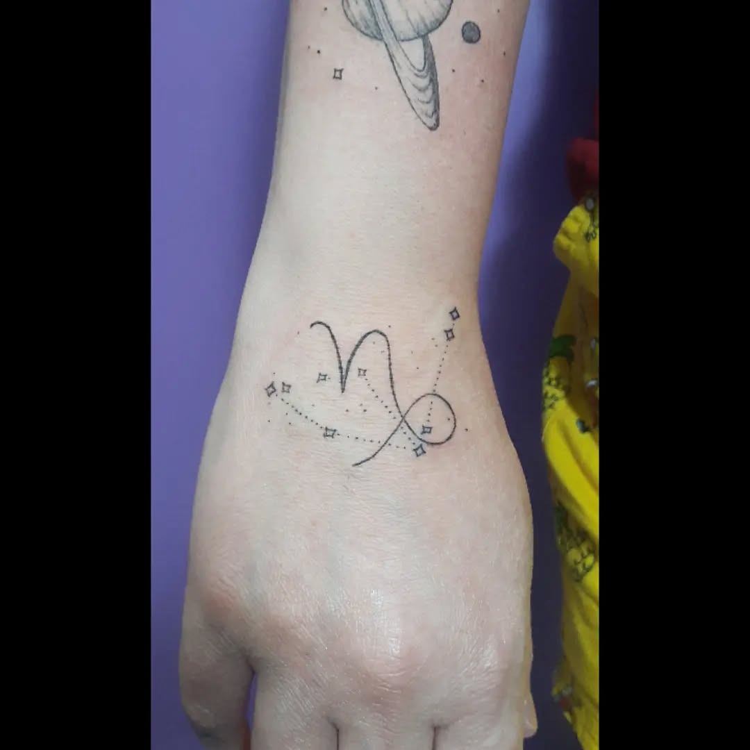 This minimalist Capricorn tattoo features the constellation design elegantly placed on the wrist.