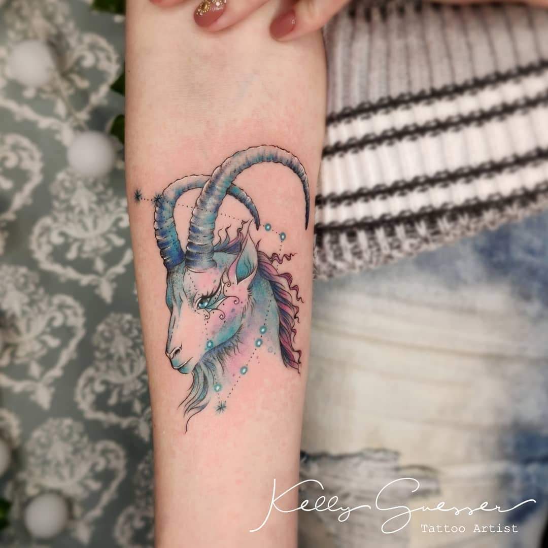 This Capricorn tattoo features a beautifully detailed goat adorned with celestial elements.
