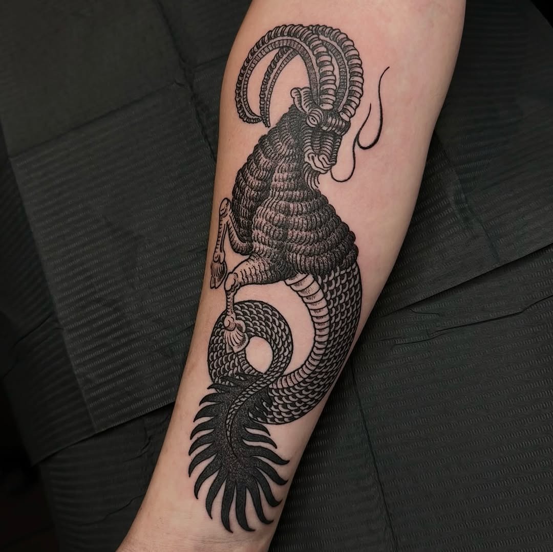 This detailed Capricorn tattoo embodies strength and elegance with its intricate blackwork.