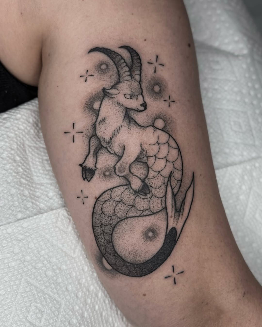 The design centers on intricate capricorn with mystical imagery that reads clearly at a glance.