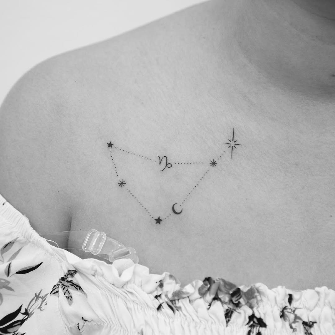 This tattoo beautifully illustrates the Capricorn constellation with delicate stars and a crescent moon.