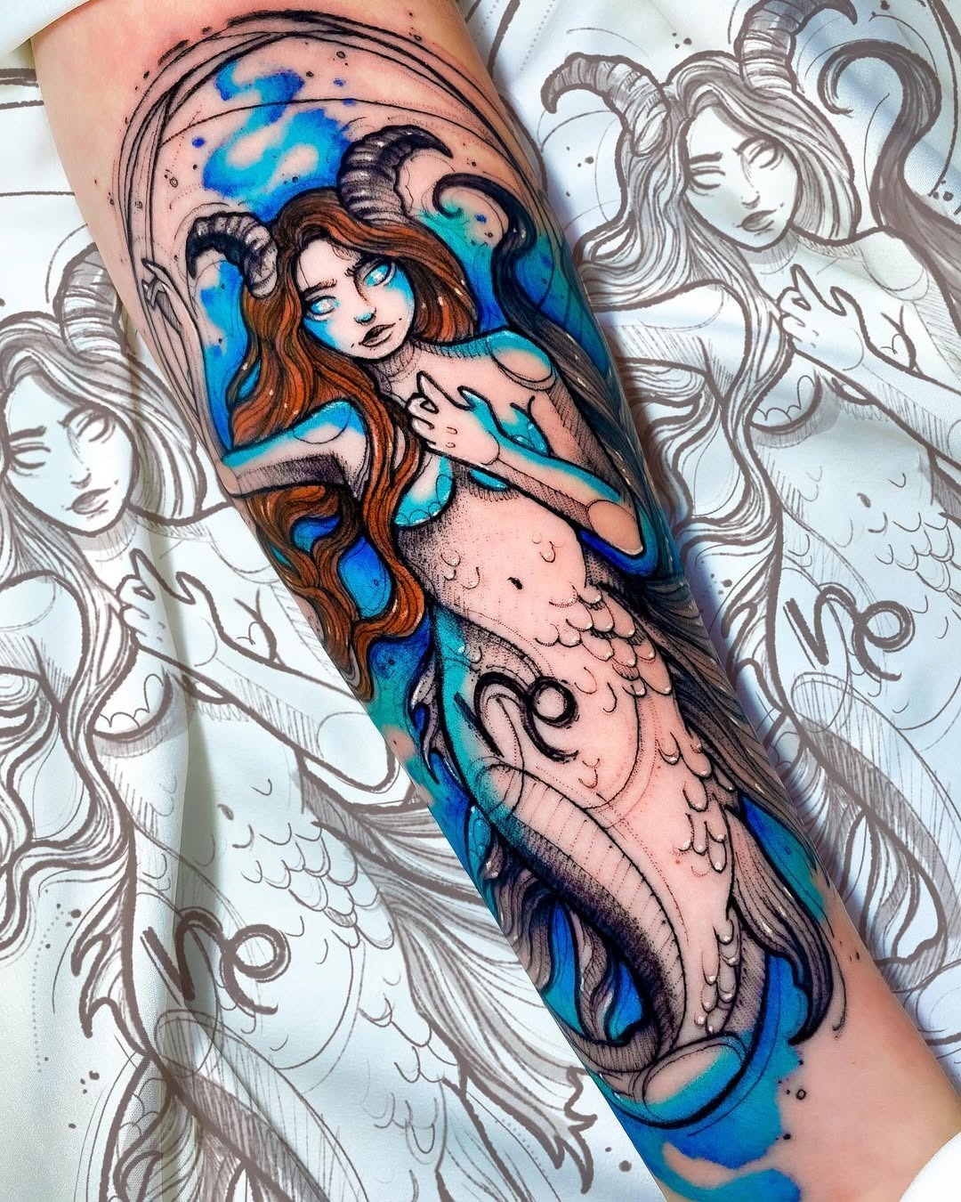 This tattoo features a unique blend of a mermaid and Capricorn symbolism.