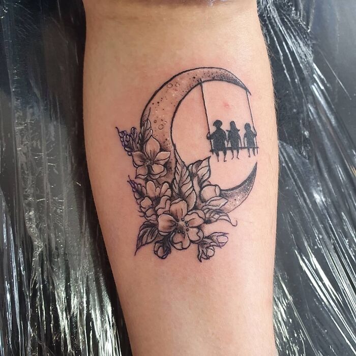 Celestial Embrace: Family on the Moon Tattoo Design