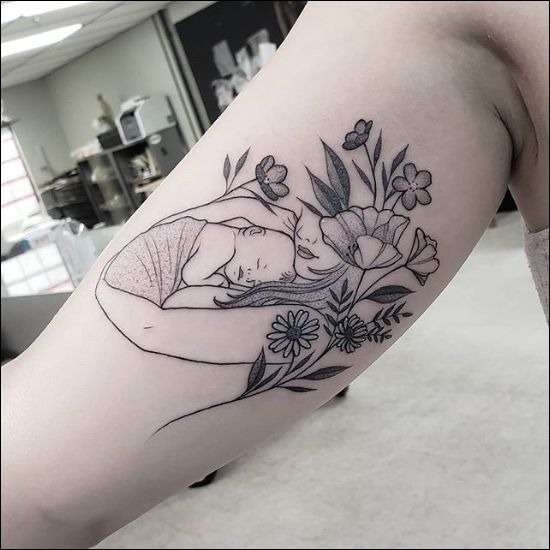 Mother and Child in Floral Embrace Tattoo Design