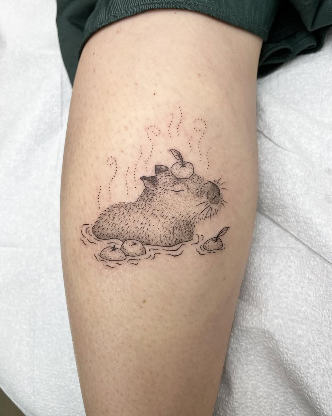 Charming capybara soaking in a peaceful bath Tattoo Design