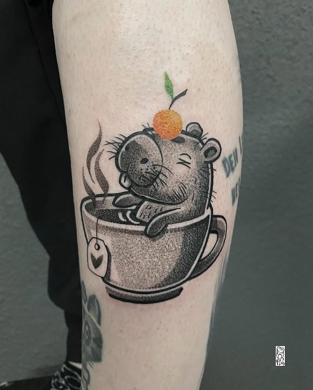Charming capybara tattoo enjoying a cozy drink Tattoo Design