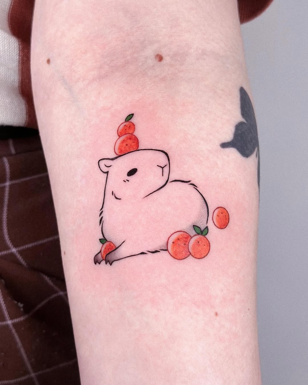 Charming capybara tattoo with a fruity twist Tattoo Design