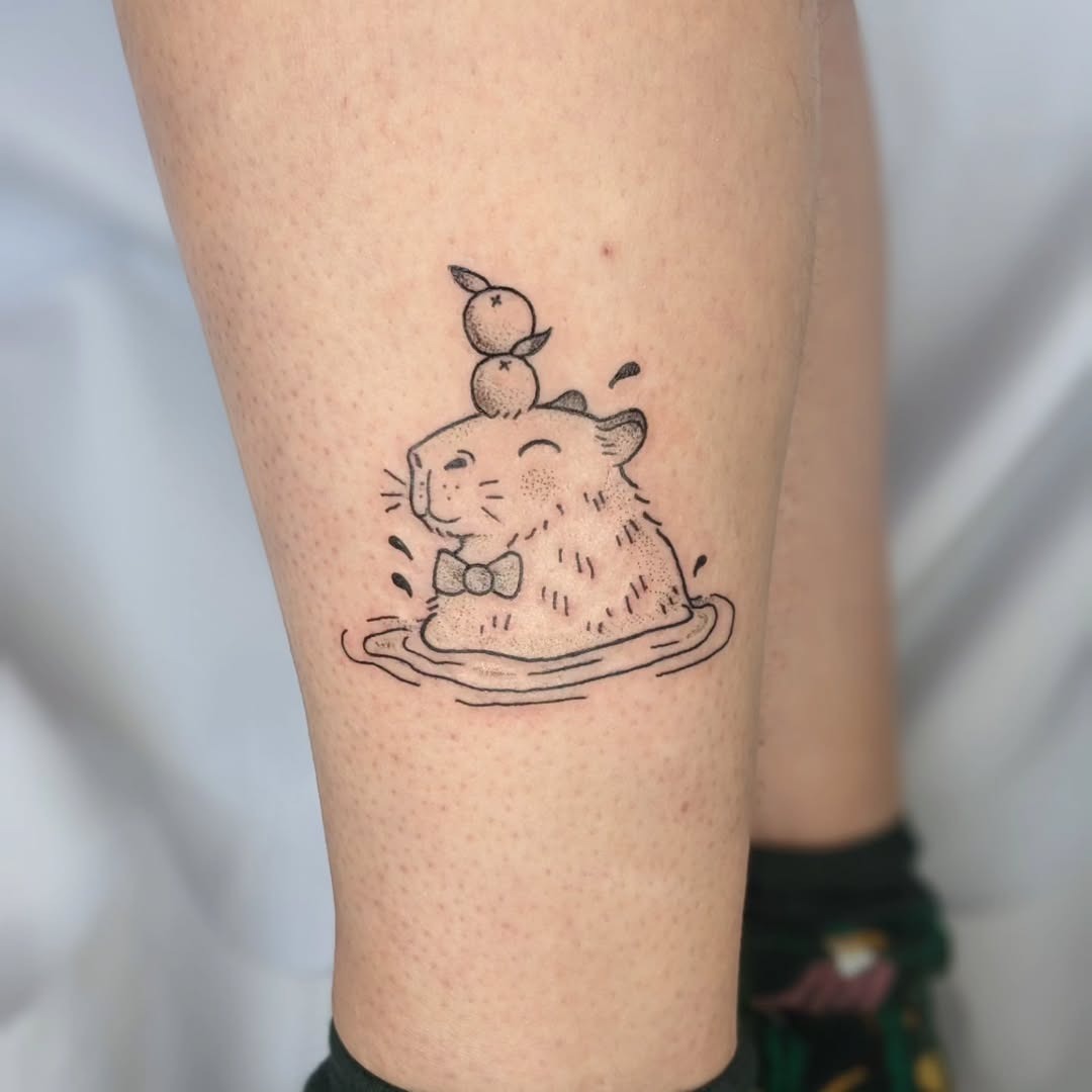 Playful Capybara Tattoo with Adorable Ducks Tattoo Design