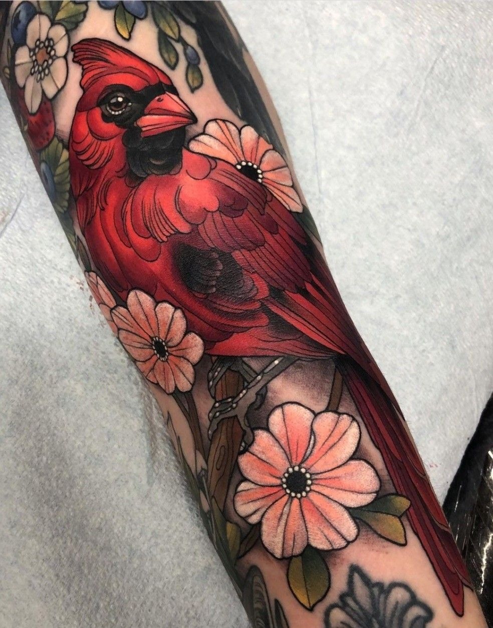 Neo-Traditional Cardinal Among Pink Flowers Tattoo Design